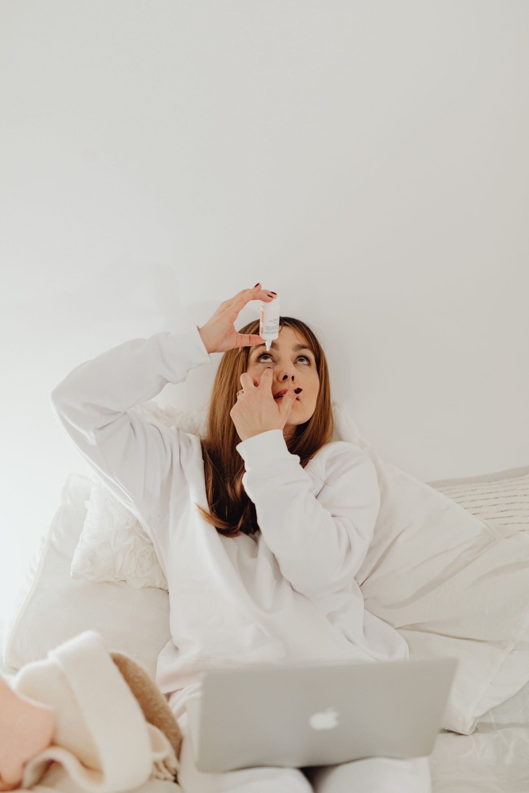 Girl using eye drops for dry eye